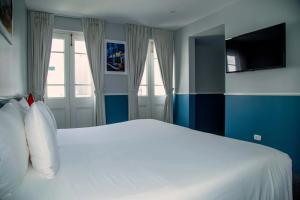 Cama ou camas em um quarto em Casa Republica Barranco Boutique Hotel
