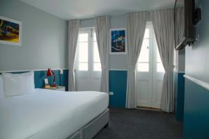 Cama ou camas em um quarto em Casa Republica Barranco Boutique Hotel
