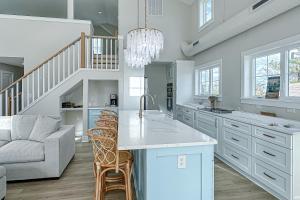 a kitchen with a couch and a table and chairs at South Bethany --- 102 Brandywine Dr in Bethany Beach