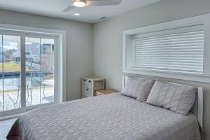 a bedroom with a bed and a window at South Bethany --- 102 Brandywine Dr in Bethany Beach