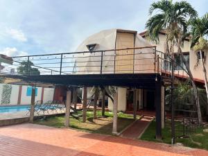 a house with a dome on the side of it at Gaman Hotel Glamping in Santa Cruz de la Sierra