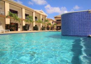 a large swimming pool in front of a building at Aruba Breeze Condo A5 in Palm-Eagle Beach