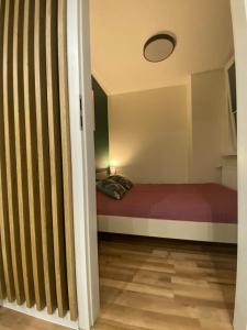 a bedroom with a bed in a small room at Apartament K&G Sosnowiec in Sosnowiec