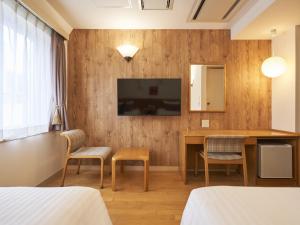 TV a/nebo společenská místnost v ubytování Hotel Toms