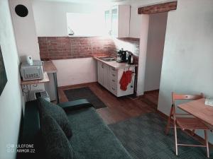 Kuchyň nebo kuchyňský kout v ubytování Apartment 1