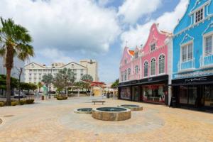 a city square in a town with buildings at Dutch Caribbean Residence C in Palm-Eagle Beach