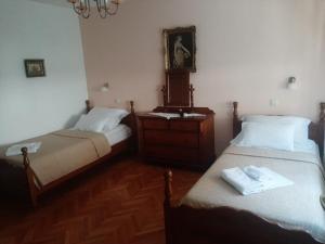 two beds sitting next to each other in a room at House Dragica in Grižane +18 photos