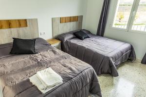 Ένα ή περισσότερα κρεβάτια σε δωμάτιο στο Casa Cristea Barranda +61 φωτογραφίες