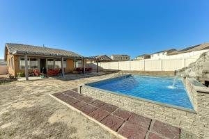 a swimming pool in the backyard of a house at Luxe Beaumont Home with Private Pool! in Beaumont