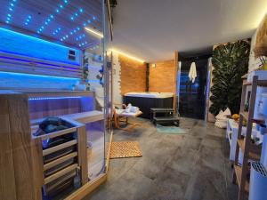 a bathroom with a shower and a room with a tub at Holiday home LUNA in Donje Orešje +60 photos