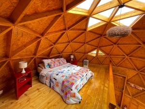 Кровать или кровати в номере Glamping Brillo de Luna
