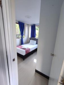 Postel nebo postele na pokoji v ubytování Hotel kristal campestre
