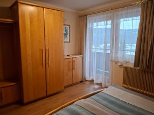 Postel nebo postele na pokoji v ubytování Fanningerwirt Holzer