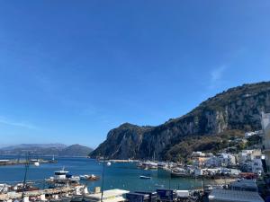 a view of a harbor with boats in the water at La Baia di Napoli in Capri