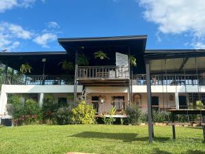 a building with a yard in front of it at Los lagos del abuelo in Montenegro +34 photos