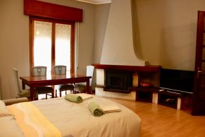 a bedroom with a bed and a fireplace and a piano at Pietro Apartment Fiera in Lainate +9 photos