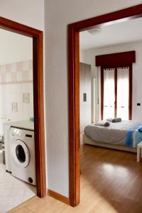 Postel nebo postele na pokoji v ubytování Pietro Apartment Fiera