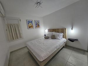 Postel nebo postele na pokoji v ubytování L'Oasis de Désert Ste Luce à 200m de la plage avec parking privé
