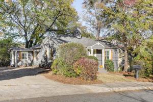 a gray house with a driveway in front of it at Walk Downtown and Canton Street Roswell Retreat! in Roswell