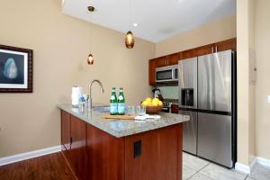 A kitchen or kitchenette at KBM Resorts FREE CAR Honua Kai Konea Ground Floor 2-Bedroom Condo with Easy Pool Access HKK-140