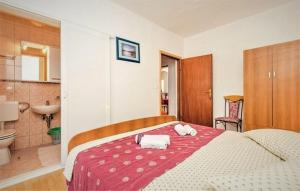 Postel nebo postele na pokoji v ubytování Apartments Mili