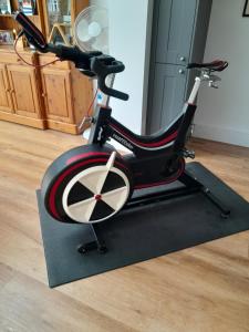 an exercise bike on a treadmill in a room at The Henge House in Salisbury