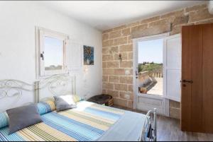 Postel nebo postele na pokoji v ubytování Trappito Stracca Agriturismo