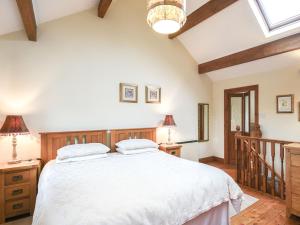 Ένα ή περισσότερα κρεβάτια σε δωμάτιο στο Curlew Cottage