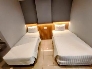 Studio One Thamrin Hotel 객실 침대