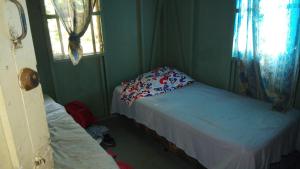 Un pat sau paturi într-o cameră la Hotel LomaVista