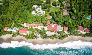 an aerial view of a resort on a beach at Tango Mar Beachfront Boutique Hotel & Villas in Tambor