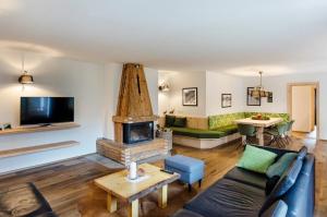 Televízia a/alebo spoločenská miestnosť v ubytovaní Appartement Romy