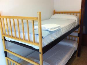 a couple of bunk beds in a room at Apartamentos Calle Mayor in Castellón de la Plana