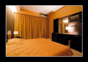 Postel nebo postele na pokoji v ubytování Hotel Cezaria