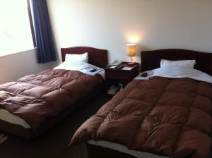 Postel nebo postele na pokoji v ubytování Prince Hotel Shimonoseki