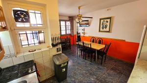 a kitchen and dining room with a table and chairs at Nueva Mansion Roca in Mendoza