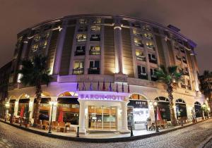 a large building on a street at night at Baron Hotel in Istanbul