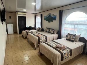 Postel nebo postele na pokoji v ubytování HOTEL DEL RiO