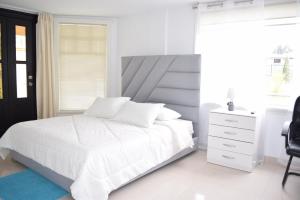 Postel nebo postele na pokoji v ubytování NAPOLES - Luxury Home