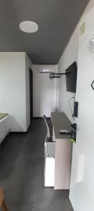 an office with a desk and a chair in a room at Zuppolini Hotel in Bananeiras