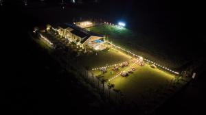 an overhead view of a park at night with lights at BEAUCHAMP VILLA in Ấp Bình Yên