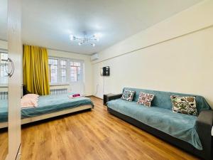 Katil atau katil-katil dalam bilik di Золотой Квадрат на проспекте Достык