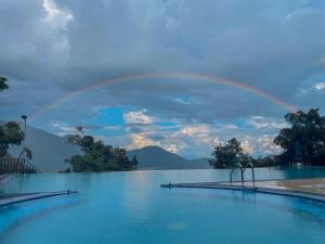 a rainbow over a swimming pool with a rainbow at Moi Ella by DBI in Ella +148 photos