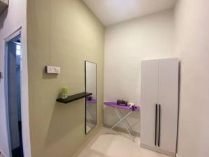 a room with a purple table and a mirror at 2 Storey Stylish Comfort Retreat ````AlmaImpianRia in Bukit Mertajam +23 photos