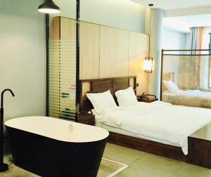 Qichi Waterfront B&B Hotel客房内的一张或多张床位
