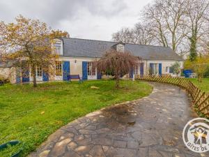 a house with a stone path in front of it at Charmant gîte près d'Angers avec extérieur privé - FR-1-622-93 in Andard