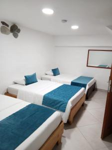 Postel nebo postele na pokoji v ubytování Hotel Santa Laura