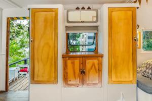 a small room with two doors and a mirror at O'Darling On The Hill in Cape Town