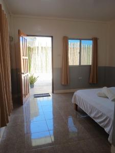Ένα ή περισσότερα κρεβάτια σε δωμάτιο στο LRS Homestay
