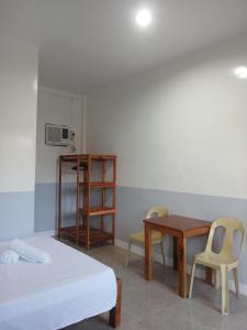 Ένα ή περισσότερα κρεβάτια σε δωμάτιο στο LRS Homestay
